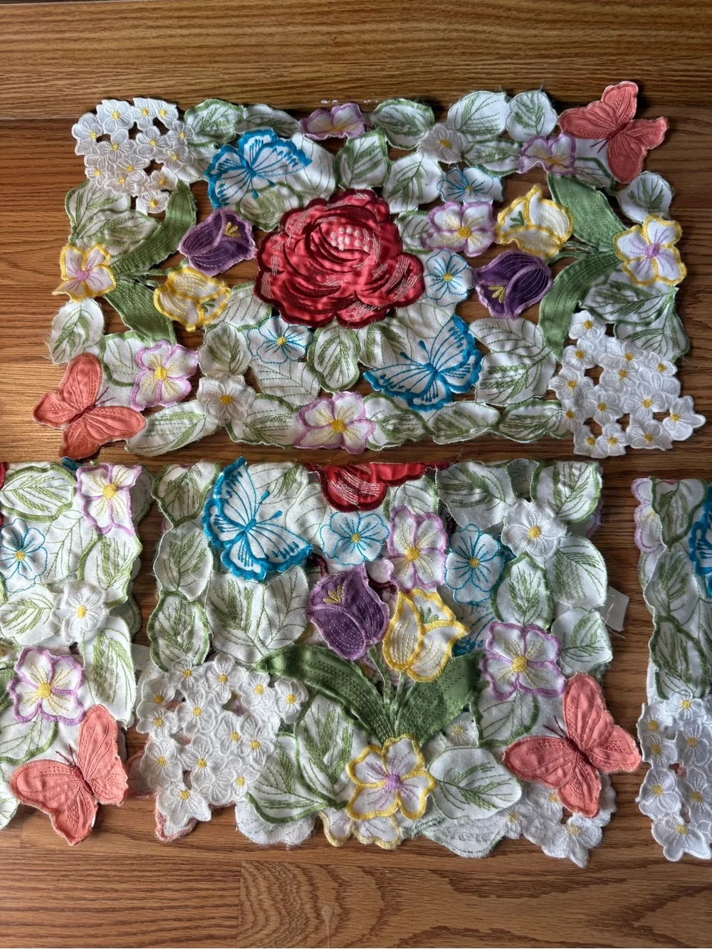 Vintage Set of Four multicolor embroidered floral & butterfly cutout placemats
